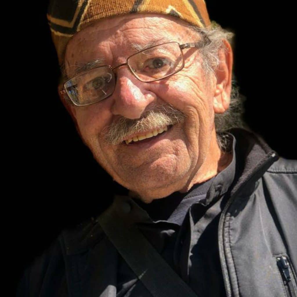 An older man with glasses