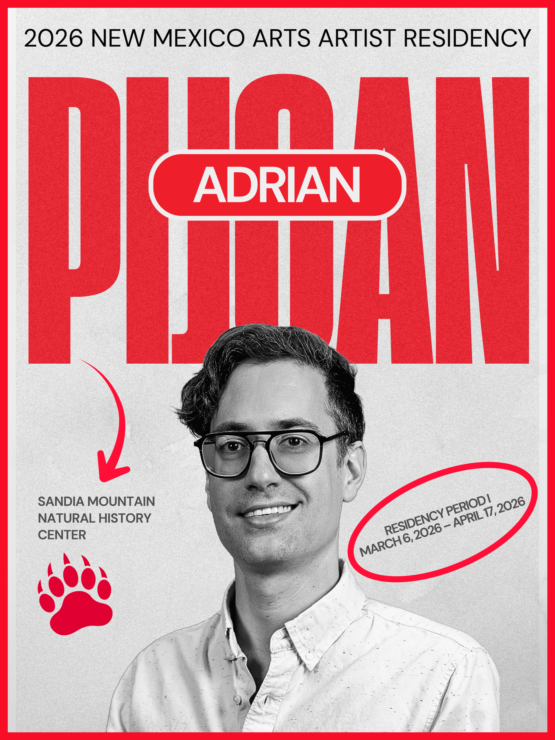 A man with short hair and glasses