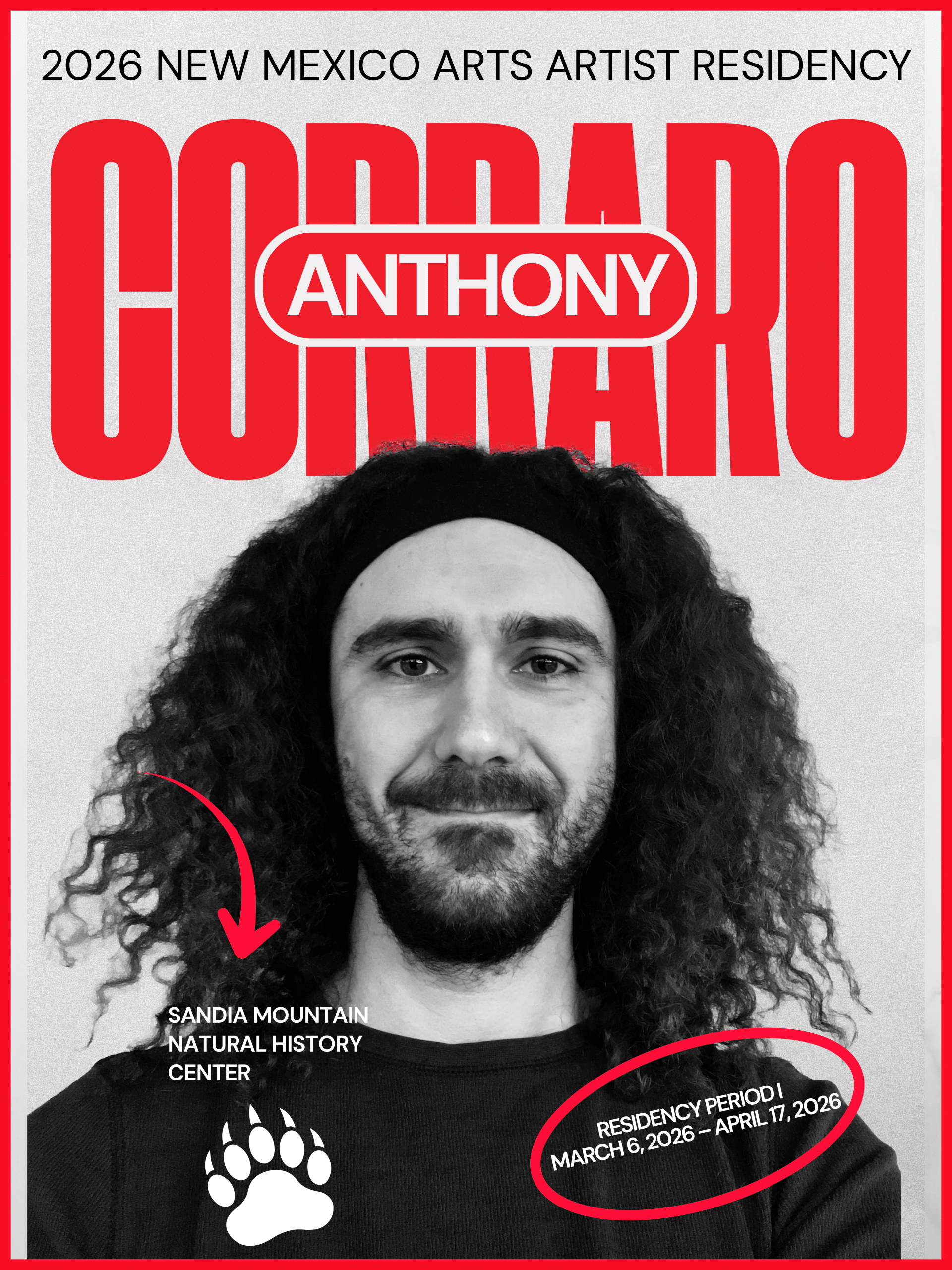 A man with long thick hair and a beard.