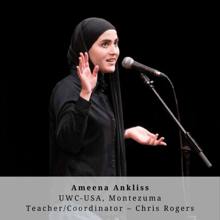 A young woman wearing a hijab on stage