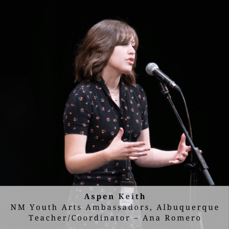 A young woman with brown hair on stage
