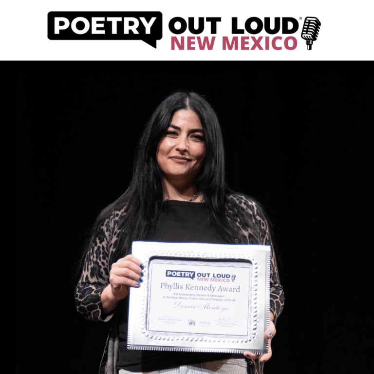 A young woman with dark hair receiving an award