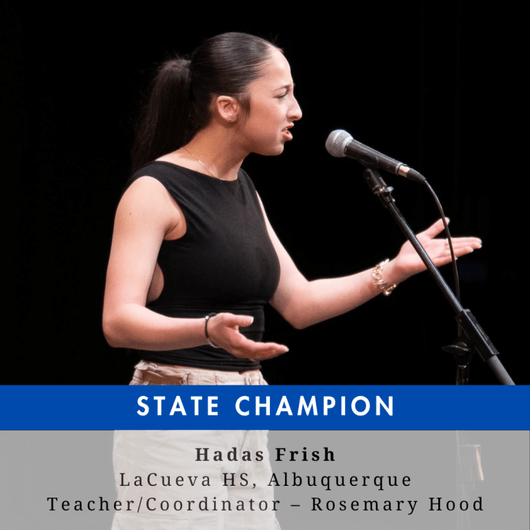 A young woman with dark hair on stage