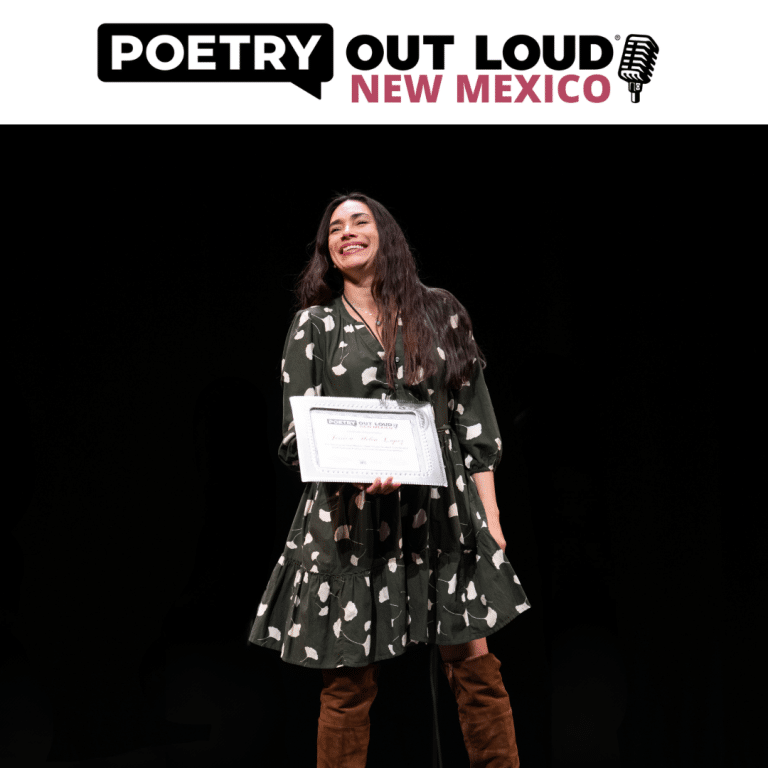 A woman with dark hair on stage