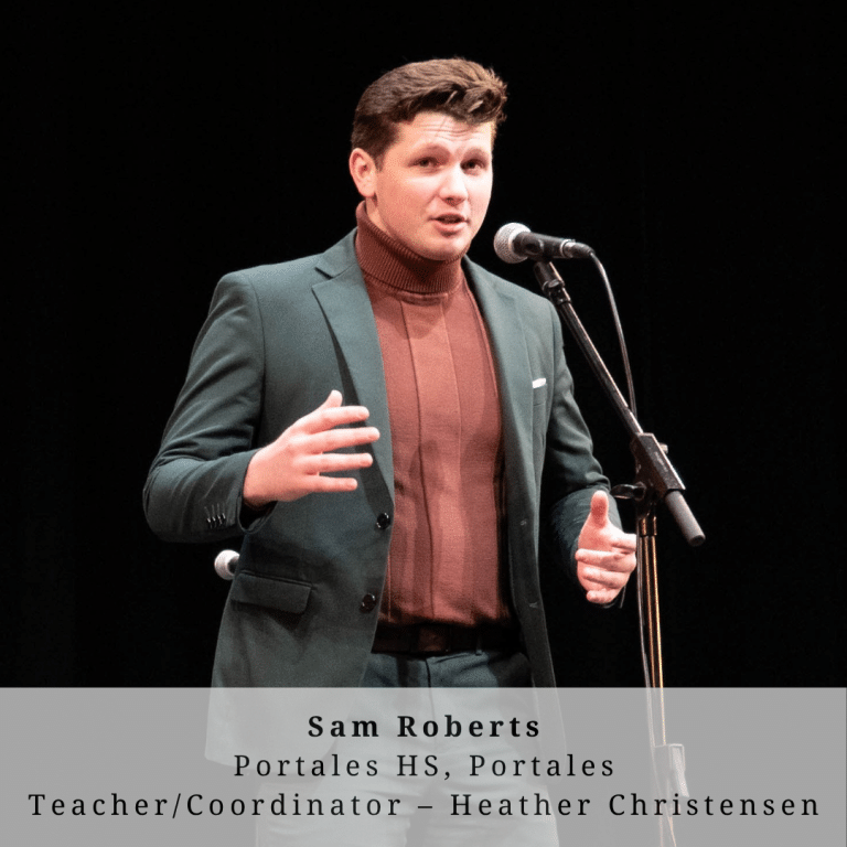A young man with redhair on stage