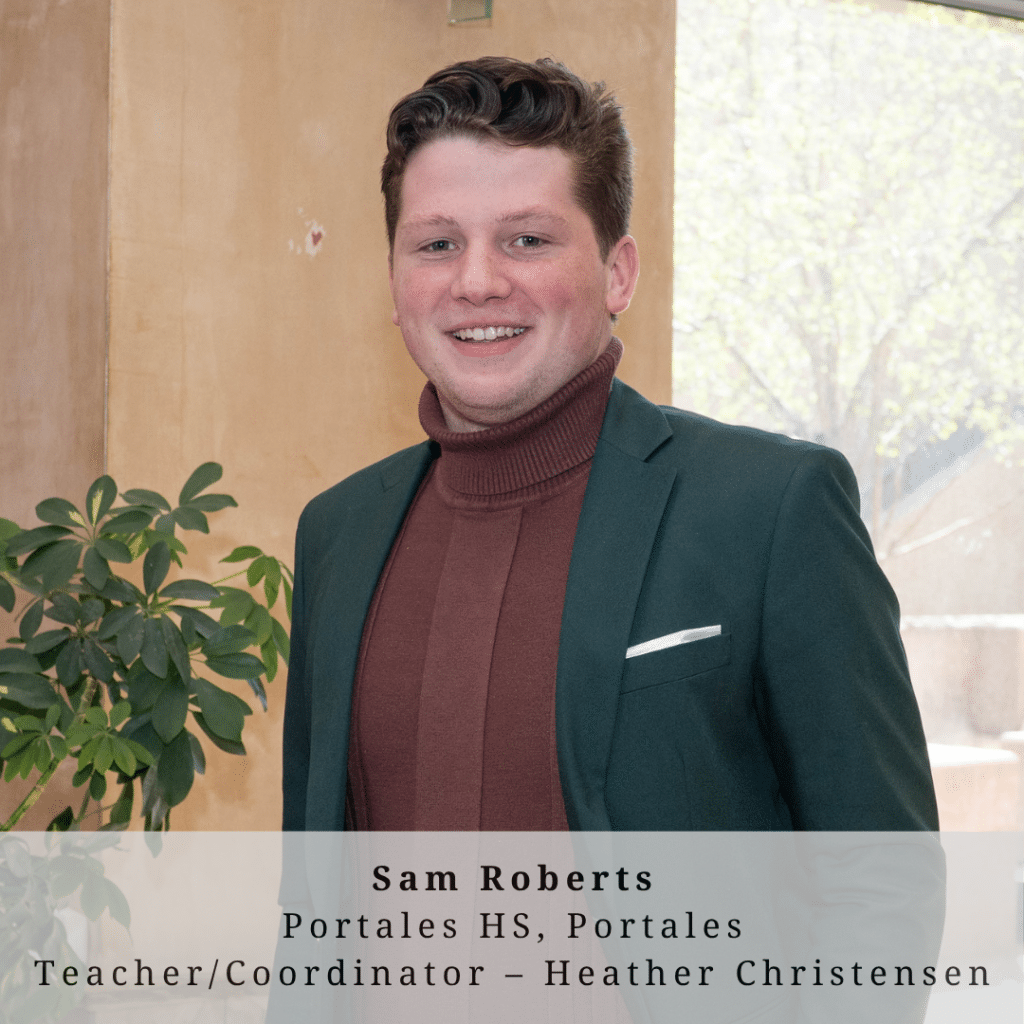 A young man with short reddish hair